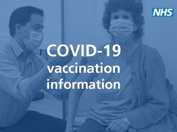 a woman receiving a COVID vaccine