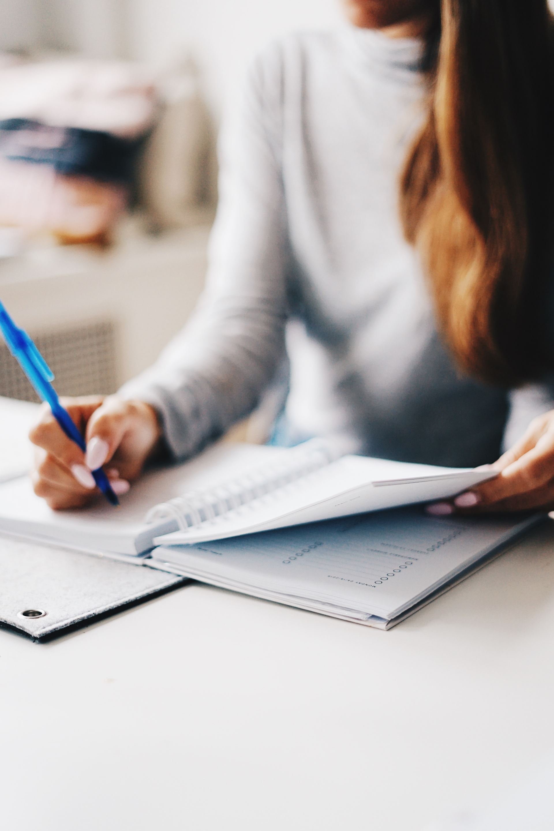 a woman writing a report