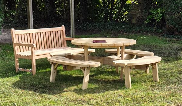 a garden bench and picnic table
