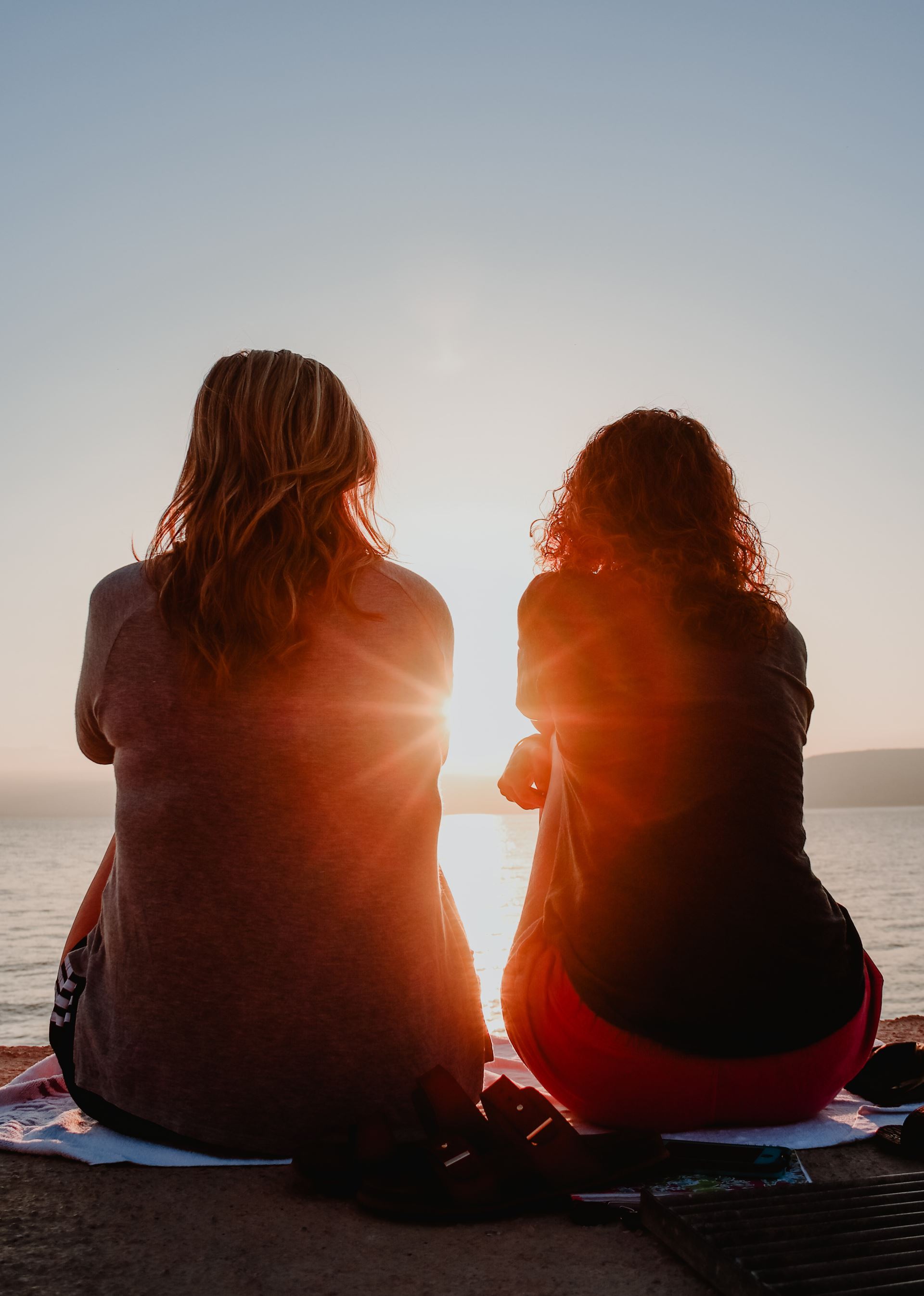 Two women watching a sunset